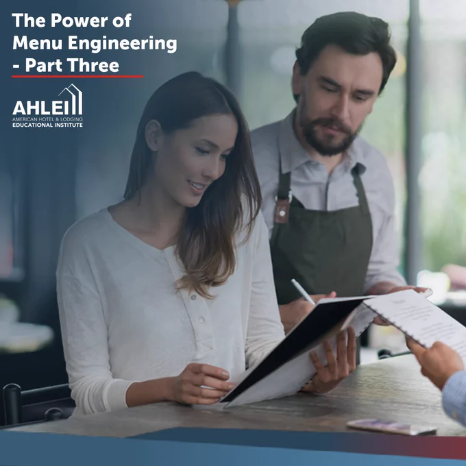 Certainly! Here's a suitable alt text:

"Two people reviewing a menu at a table, with one holding a pen. Text on the image reads 'The Power of Menu Engineering - Part Three'. The AHLEI logo is visible in the bottom left corner."