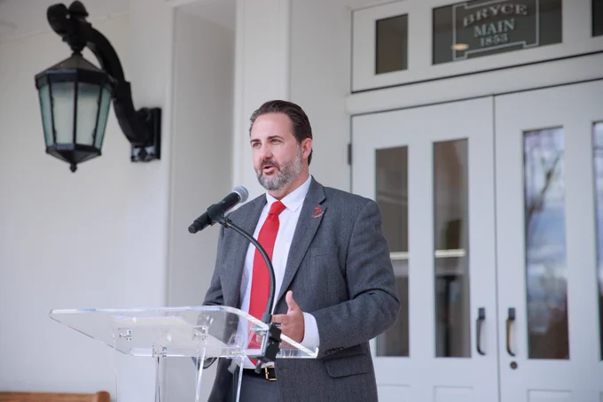 COMPASS Director Daniel White speaking at a podium