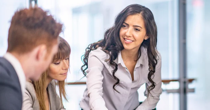 Three people in an office setting 