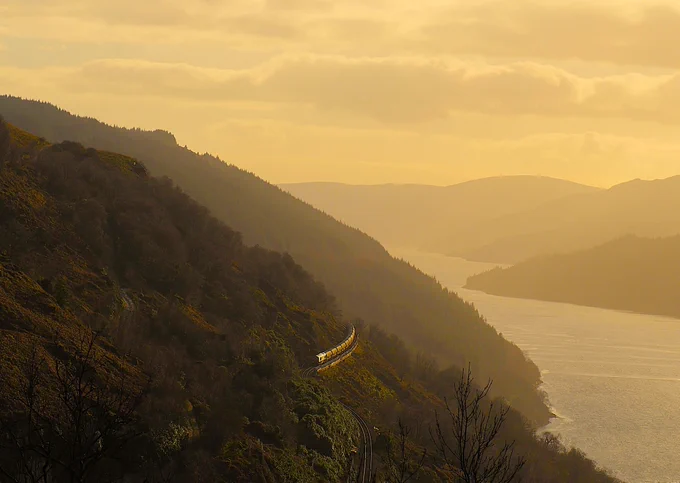 "Yesterday’s down Alcan (6S45) creeping down the side of Loch Long, a few minutes early, worked by 66741 (RTT tells me)." - Sandy Smeaton 

 March 3rd 2026