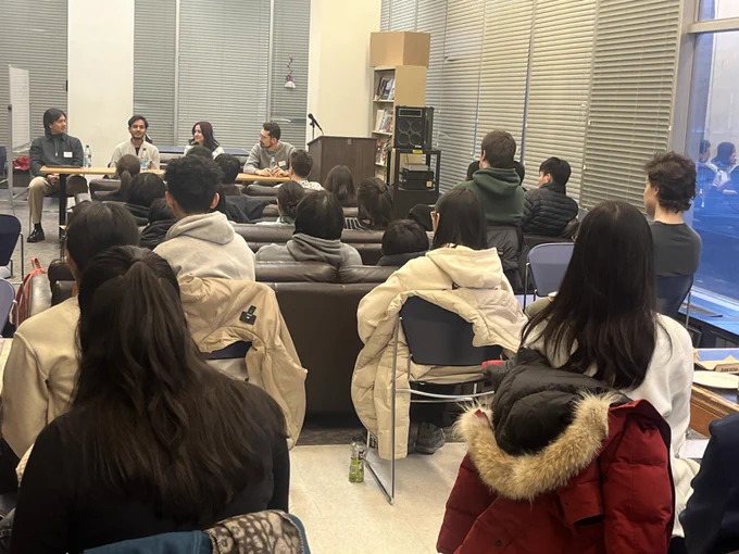 Students attending a panel.
