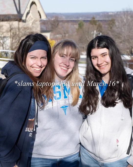 Three students taking a photo together with "*slams laptop shut until March 16*" as text on the image. 