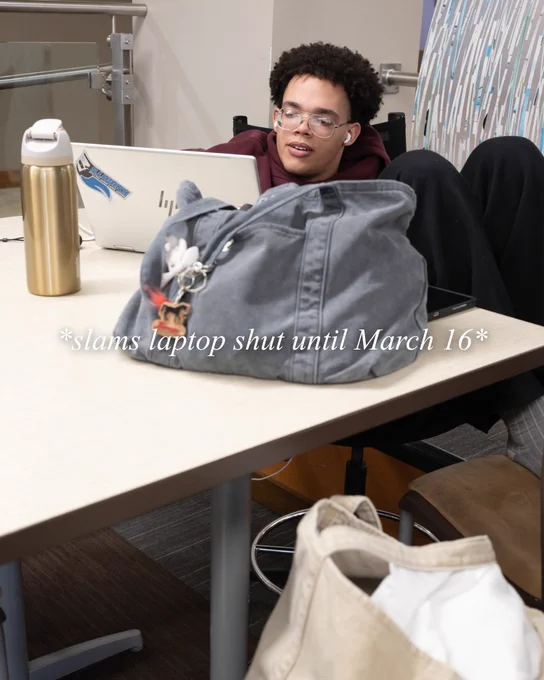 One student looking at their laptop with "*slams laptop shut until March 16*" as text on the image. 