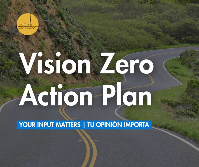 A scenic, winding road through green hills is shown with the "Vision Zero Action Plan" text prominently displayed. Below, it reads, "Your Input Matters | Tu Opinión Importa." The County of Sonoma logo is visible in the upper left corner.