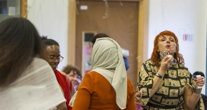 Rainbow Haven staff and clients having fun in the drop-in with bubbles