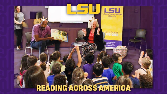 A person is reading a book to a group of children at LSU's College of Human Sciences & Education. Another person sits nearby, smiling. The background shows an LSU banner and logo. The children are seated and appear attentive. Text at the bottom reads "Reading Across America.