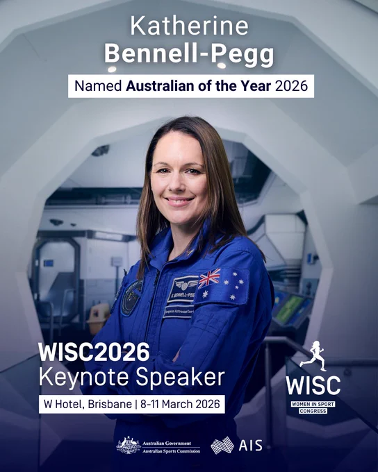 A female astronaut stands in a space shuttle. 