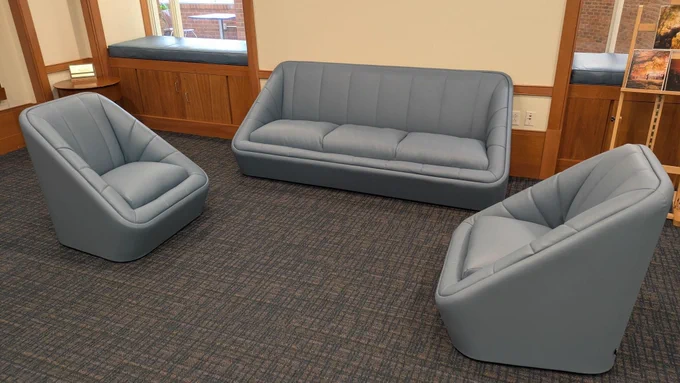two blue chairs and one blue couch