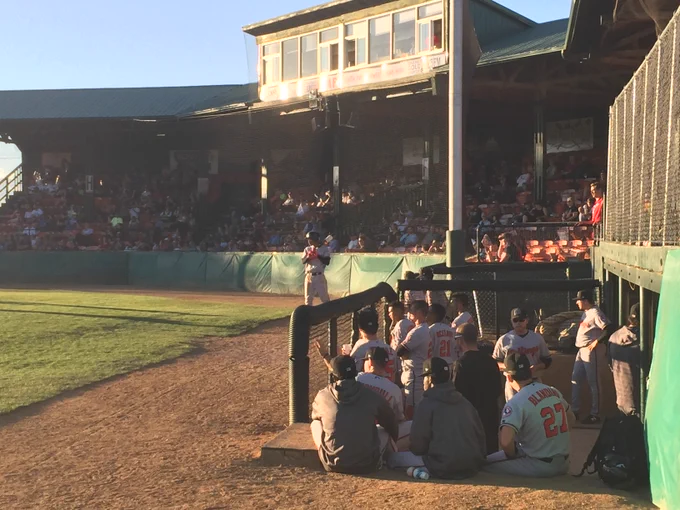 Photo: view of a below-ground dugout during baseball game