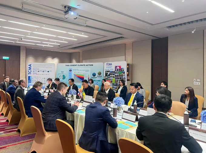 Government and post-secondary institution delegation from Saskatchewan sitting at a meeting table with representatives from the Thailand Cement Manufacturers Association.