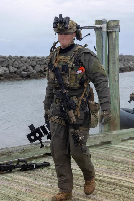 A U.S. Coast Guardsman with the Maritime Security Response Team East unloads gear during an advanced interdiction training exercise in Marine Corps Air Station Cherry Point waterway, North Carolina, Feb. 26, 2026. The MSRT-E is a deployable, specialized force that conducts counterterrorism and direct-action missions. MCAS Cherry Point waterways facilitates crucial maritime training opportunities across the Department of War and the Department of Homeland Security to strengthen the operational readiness of the joint force. (U.S. Marine Corps photo by Lance Cpl. Dillon Anderson)