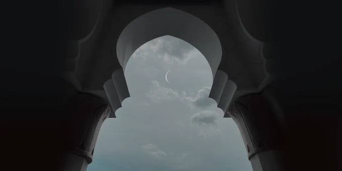 Arched doorway facing the moon in the sky.