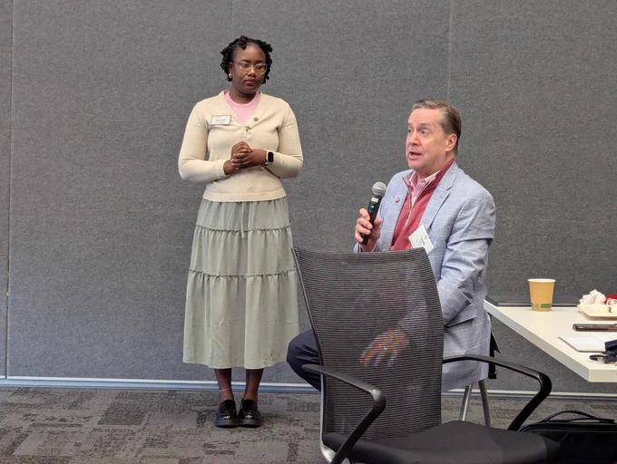 A leadership breakfast attendee speaking during the Q&A session