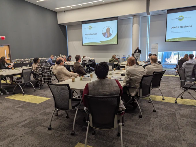 Leadership breakfast attendees listening to closing remarks from IEI National Advisory Board Emeritus Abdul Rasheed