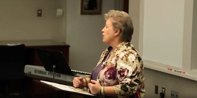 screen snip from a digitized video recording of Dr. Nancy Lammers Gross delivering her response to Earl Palmer's preaching during The Exposition Seminar I: The Joy of Expositional Preaching, November 5, 2015; close up frame of Dr. Lammers Gross in profile