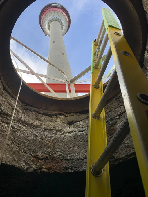 The Calgary Tower viewed looking up from an underground maintenance hole.
