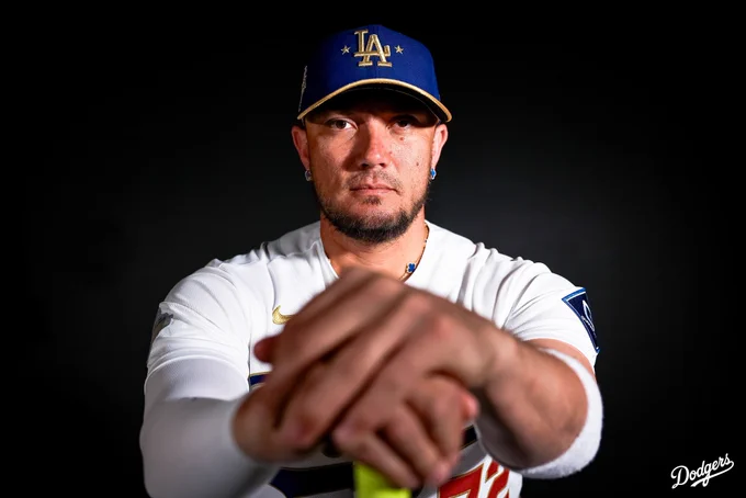 A photo of Miguel Rojas looking at the camera while wearing his Dodgers gold jersey.