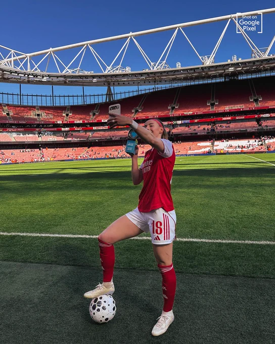 Chloe Kelly takes a selfie with her Player of the Match award.