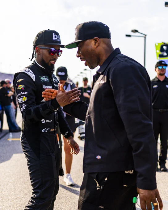 Rajah Caruth and Charlamagne Tha God on pit road before the O'Reilly Auto Parts Series race at Darlington.