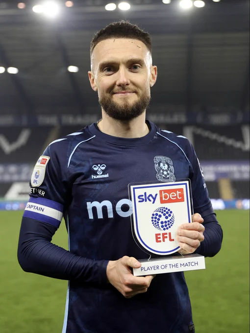 Matt Grimes and his Player of the Month trophy.