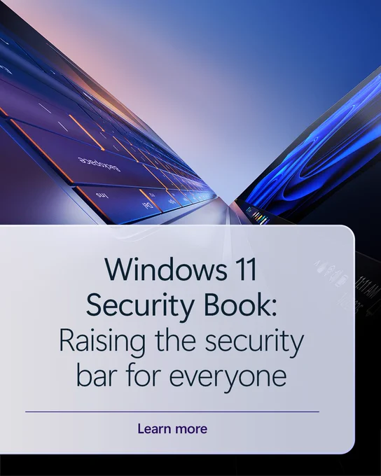 Promotional graphic featuring two angled laptop screens with colorful Windows 11 interface visuals against a gradient sky backdrop. A translucent white panel in the foreground displays the text: ‘Windows 11 Security Book: Raising the security bar for everyone.’ Below it is a ‘Learn more’ prompt.