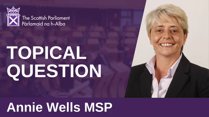 A graphic that says "Topical Question - Annie Wells MSP" beside a photo of Annie Wells MSP.