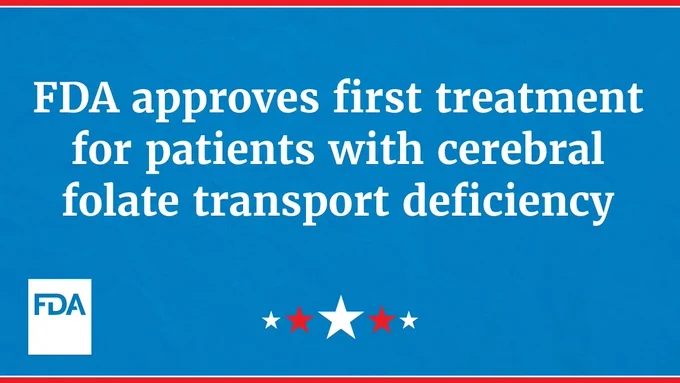 The image features text stating, "FDA approves first treatment for patients with cerebral folate transport deficiency," on a blue background. The FDA logo is in the bottom left corner, and there are decorative red and white stars at the bottom.