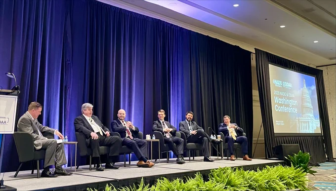 Ben Page sitting on stage with others at the 2026 NADO and DDAA Washington Conference. 