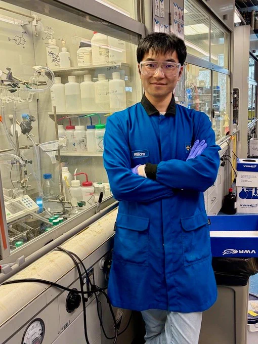 Full-color image of member of the MacMillan Lab at his bench.