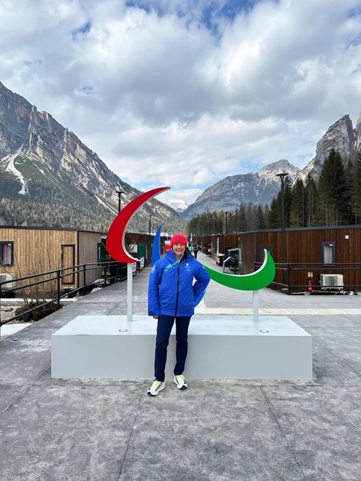 Stephanie Peacock MP in front of the Three Agitos at the Paralympics in Milano Cortina