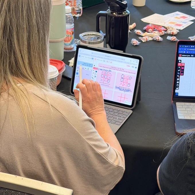A teacher using the secret project during a session.