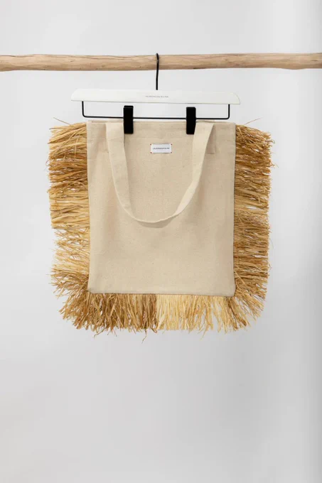 LaurenceAirline natural raffia tote bag in beige cotton with raffia trim, available online at House of NALA