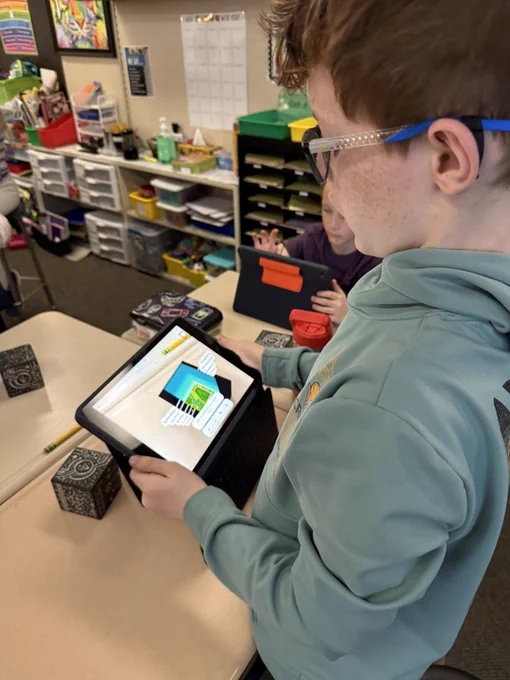 Student using merge cubes