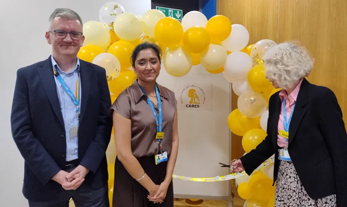Chief Executive Matthew and Mandeep stand while our Chair Sarah prepared to cut the ribbon