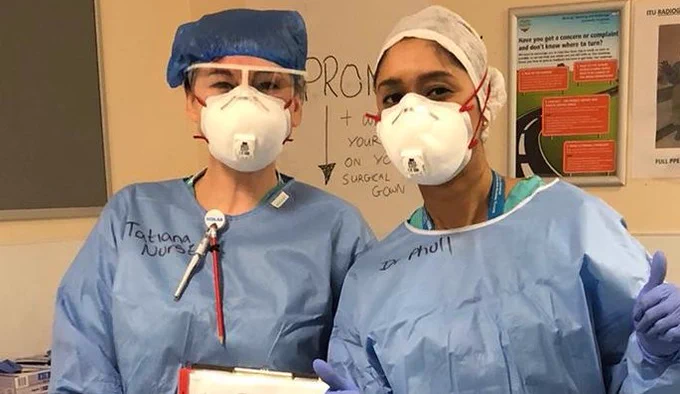 Mandeep and a colleague wearing full PPE during the pandemic