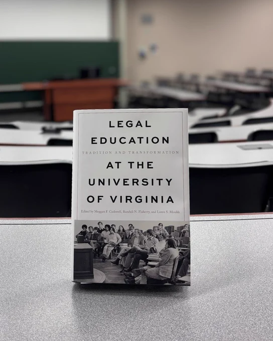 The book, Legal Education at the University of Virginia, on a lecture hall table.