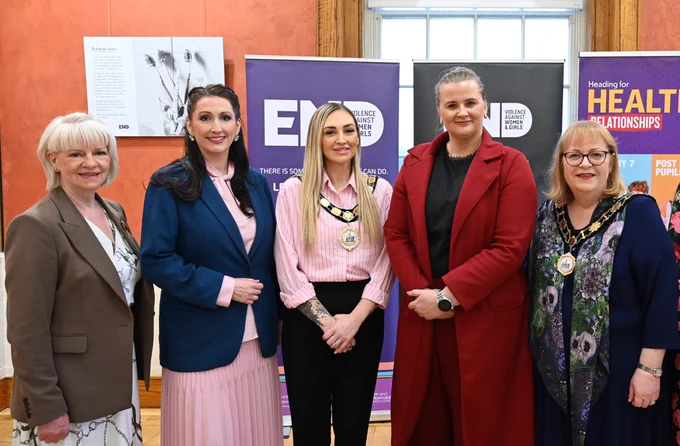 Image of five people standing – pictured left to right are: Gillian Creevy, CEO Women’s Aid Antrim, Ballymena, Carrickfergus, Larne, and Newtownabbey, deputy First Minister Emma Little-Pengelly, Mayor of Antrim and Newtownabbey Borough Council, Leah Kirkpatrick, Junior Minister Aisling Reilly and Deputy Mayor of Antrim and Newtownabbey Borough Council, Julie Gilmour.