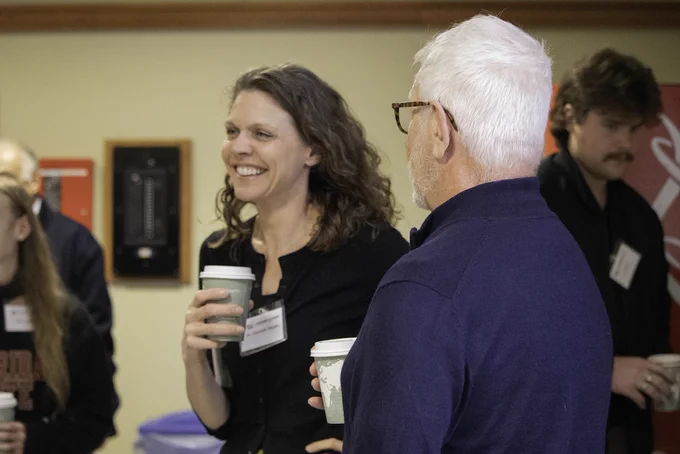 Event photo from the 2026 Langford Conference. Image depicts attendees conversing and smiling. 