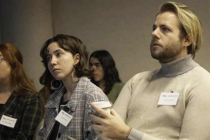Event photo from the 2026 Langford Conference. Image depicts attendees listening intently to a speaker. 