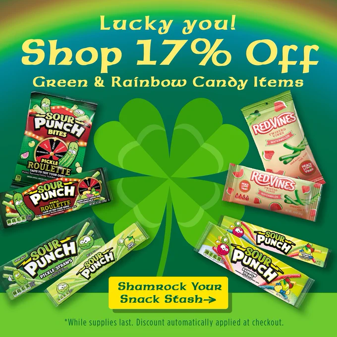 Lucky-themed promotional image featuring a shamrock background. Text advertises "Shop 17% off Green & Rainbow Candy Items" with Sour Punch and Red Vines products displayed. A note mentions the discount is applied automatically at checkout.