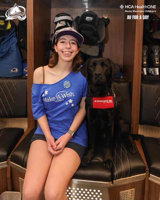 Av for a Day Sabrina with team dog Maxy inside the Avalanche locker room