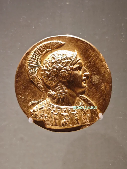 A huge gold medallion showing Alexander the Great, king of the ancient Greek kingdom of Macedonia, wearing an Attic helmet with a shield to his side. This was minted in the early 3rd century AD during Roman times probably in Veria/Veroia, Macedonia, Greece. The Romans much revered Alexander the Great. It was found with 19 other medallions, 600 gold coins and 20 stamped gold ingots in Aboukir, Egypt in 1902 and is now on display in the Gulbenkian Museum in Lisbon, Portugal. Another part of the hoard is in the Bode Museum in Berlin, Germany.