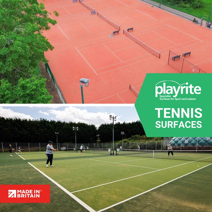 Aerial view of multiple red clay tennis courts surrounded by greenery and fencing.