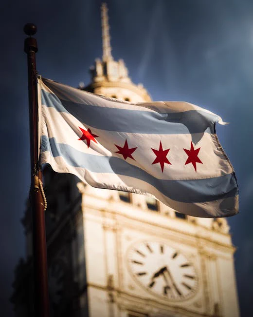 Chicago flag prominently waves in the foreground with the iconic clock tower blurred in the background.