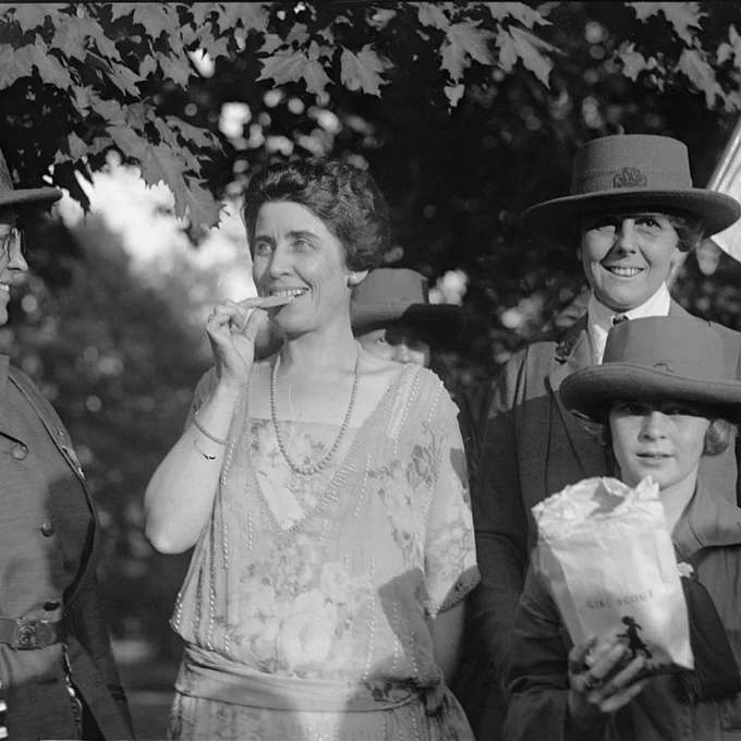 Mrs. Coolidge eating cookies [with Girl Scouts], 10/17/23. October 17, 1923. National Photo Company Collection. Library of Congress Prints and Photographs Division.