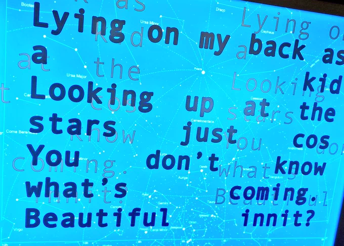 Blue backlit screen with  black poem text