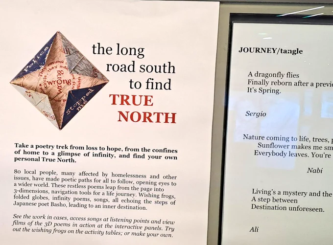 Text about poetry exhibition with origami compass 