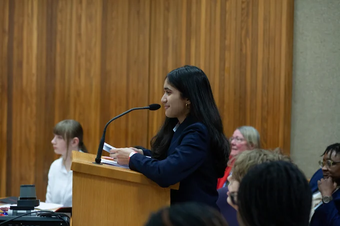 A student participants engage in various court roles  in courtroom for a mock trial during the 2026 Youth Law Fair.