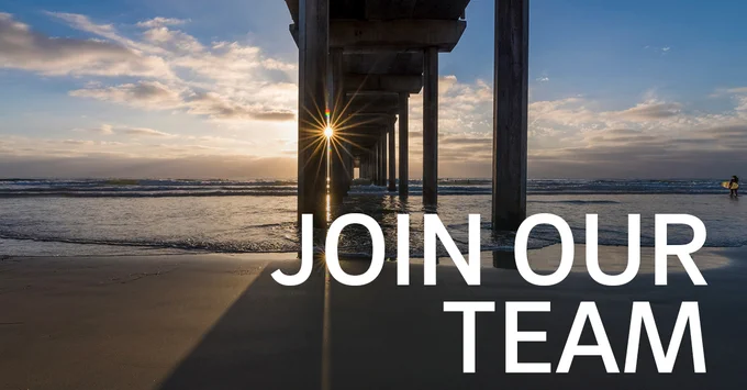 "Join Our Team" text overlayed on a photo of the sun setting at Scripps Pier