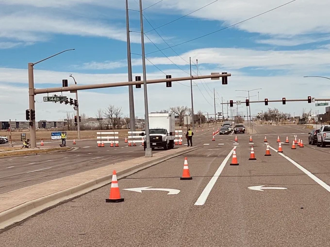 Road closure with cones and barricades